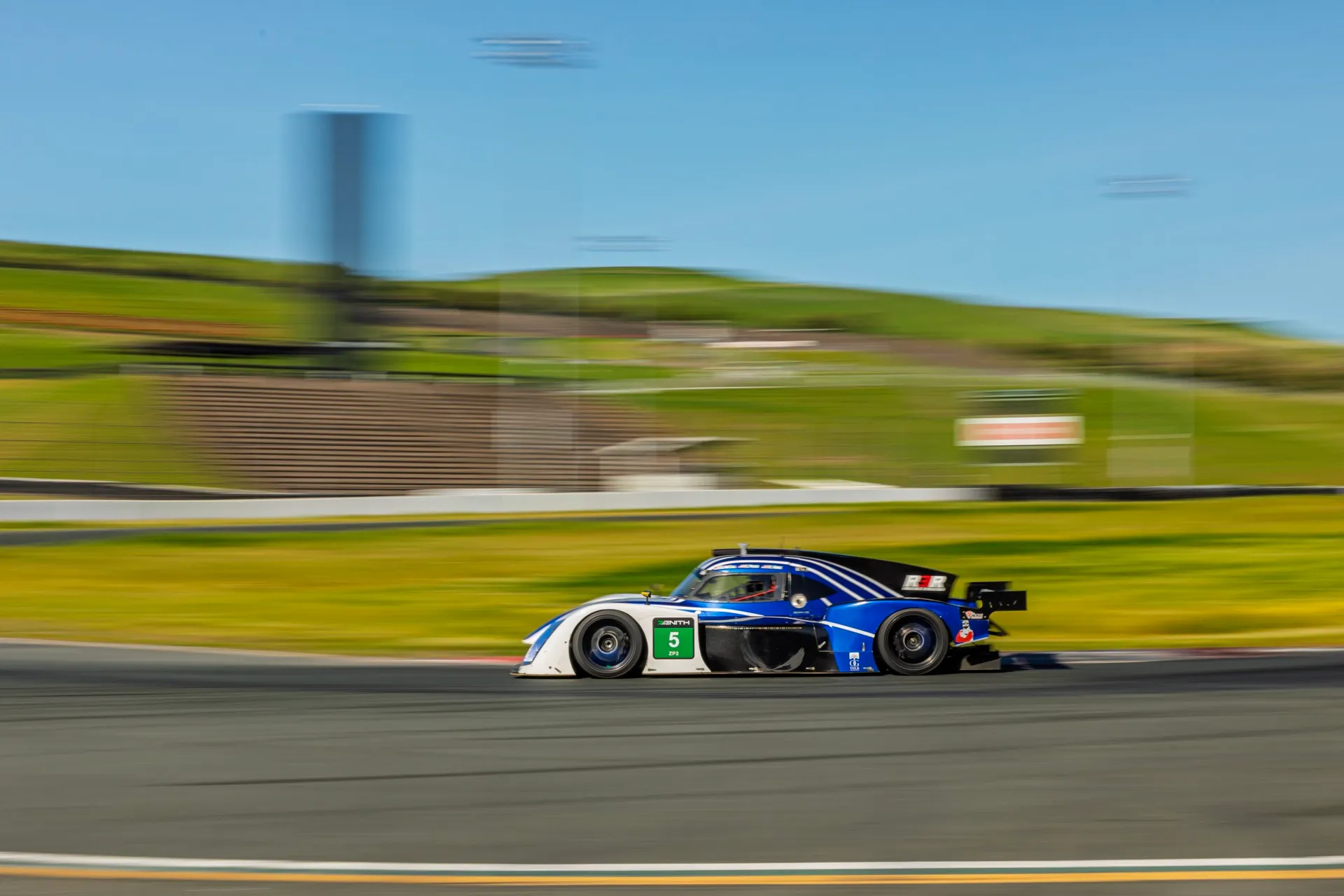 The blue #5 at speed. Kinne shares the seat with Brad McCall and Carter Pease. Photograph by Zenith Racing Series.
