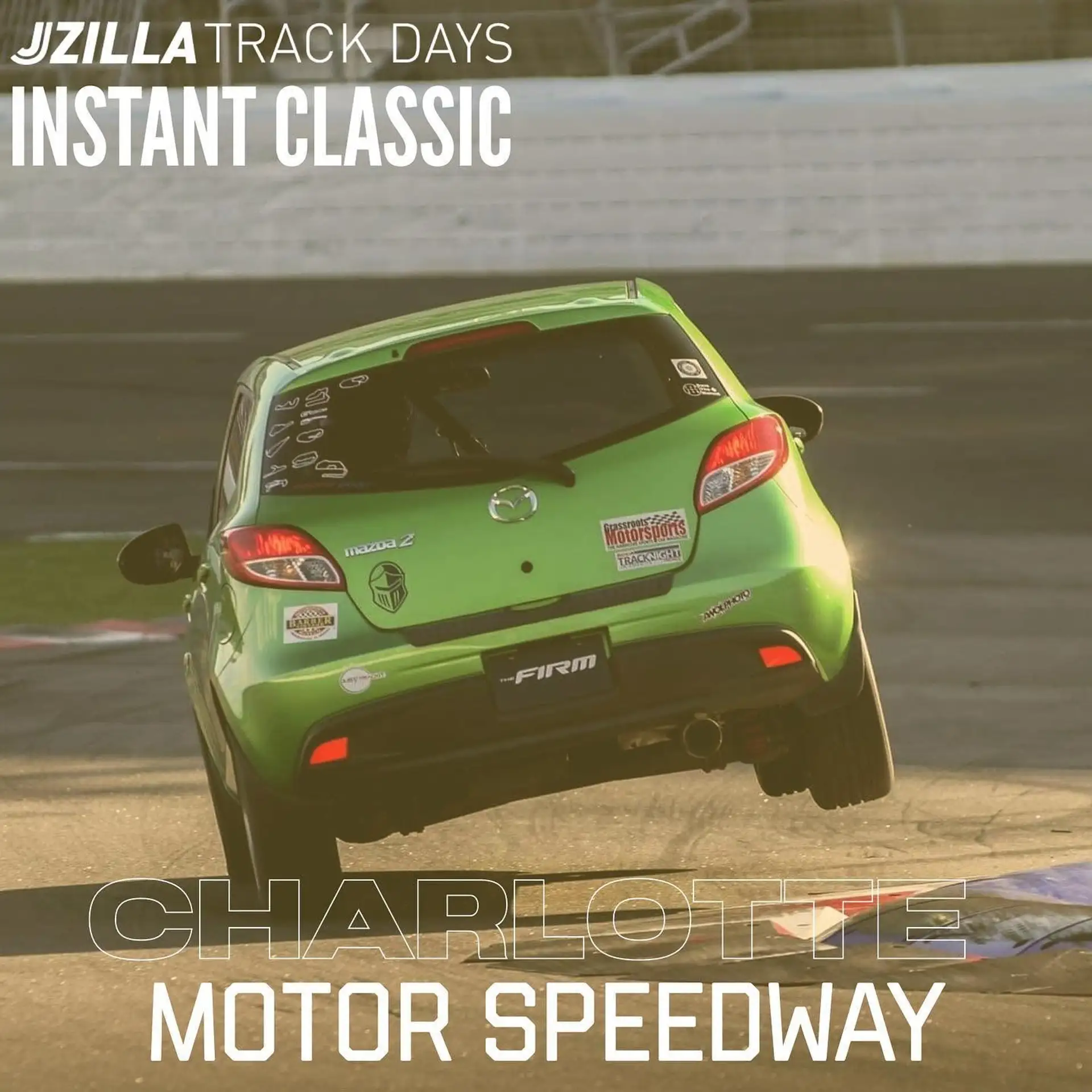 The Jzilla Track Days 'Instant Classic' graphic: Gino Manley's green Mazda2 airborne over the chicane at Charlotte Motor Speedway, JZILLA TRACK DAYS and CHARLOTTE MOTOR SPEEDWAY lettering set across the frame.