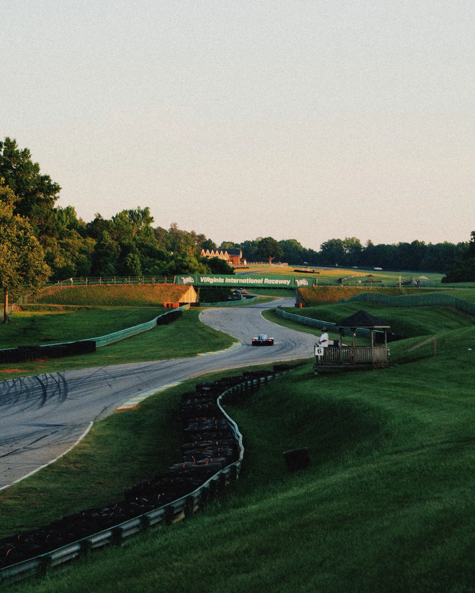 Golden hour over VIR's esses, 3.27 miles of rolling corners that take twelve hours to run and a whole field to survive.