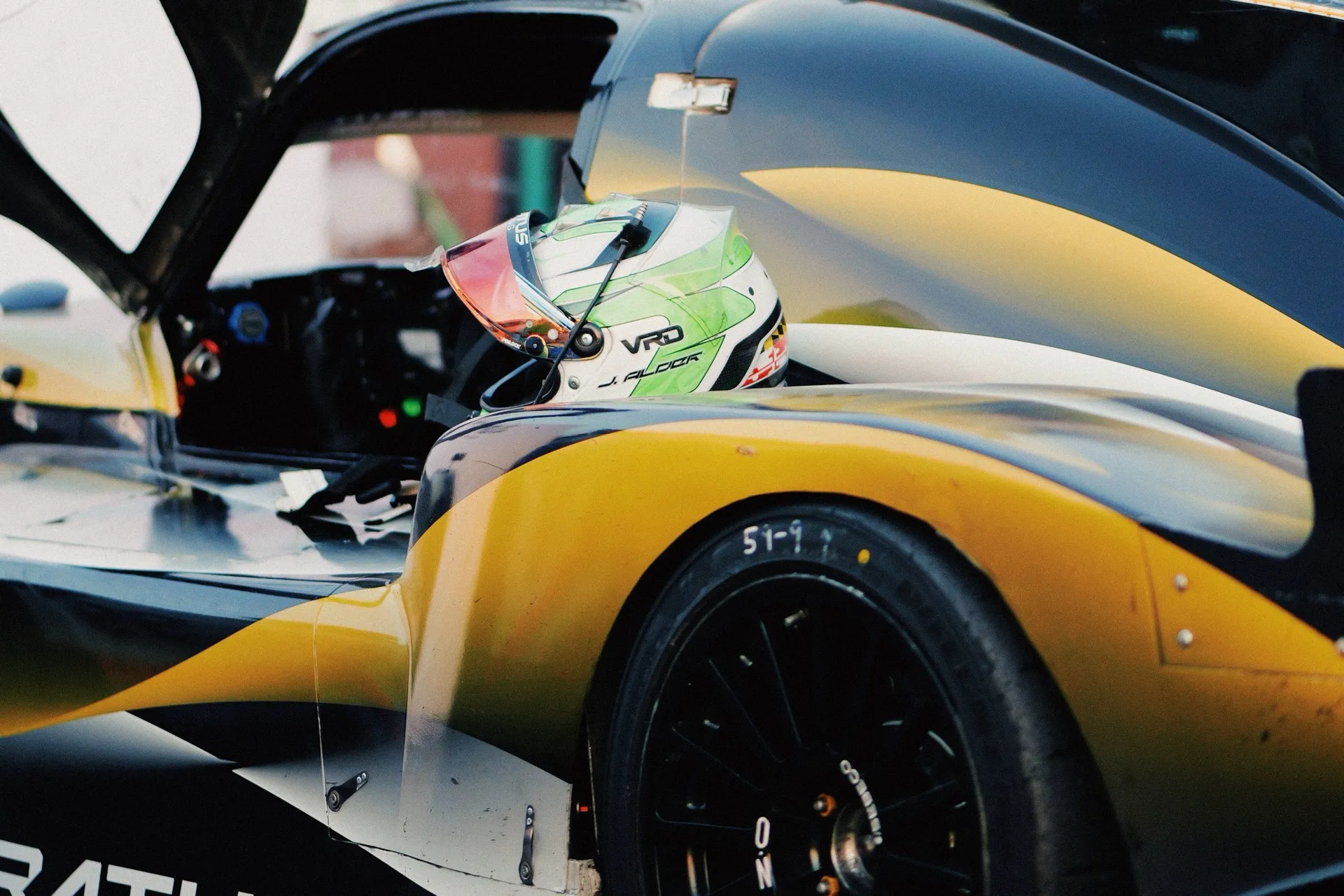 Jason Alder's #59 in the last of the light at VIR, his helmet waiting on the seat. The car he, Clay Magouyrk and Linus Lundqvist drove to the overall win.